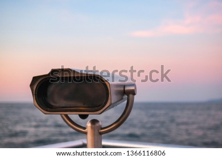 Sightseeing Binoculars with Beach Background.