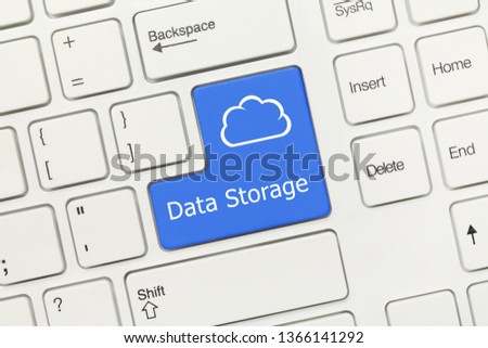 Close-up view on white conceptual keyboard - Data Storage (blue key with cloud symbol)