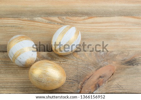 Happy Easter. Painted eggs on wooden table. Top view