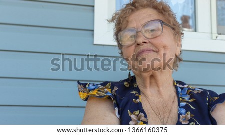 Grandma at the window of her house