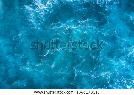 Top view of blue frothy sea surface. Shot in the open sea from above. Royalty-Free Stock Photo #1366178117