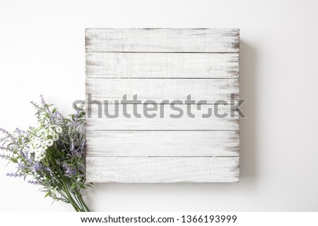 Blank rustic white wood sign with flower decor, mock up
