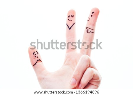 faces painted on the fingers, the scene of a quarrel