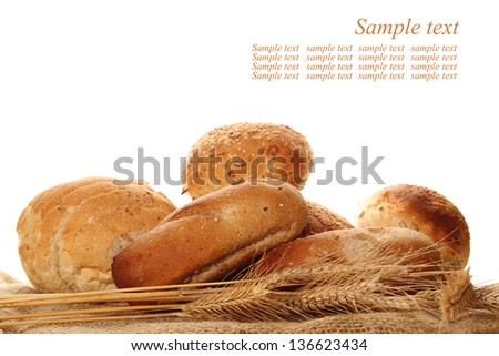 A lot of different breads are on sackcloth. isolate