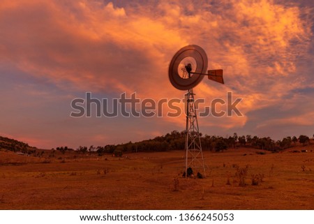 Beautiful, evening light over windmill at Melville. Near Maitland , Hunter Valley region of N.S.W. Australia.