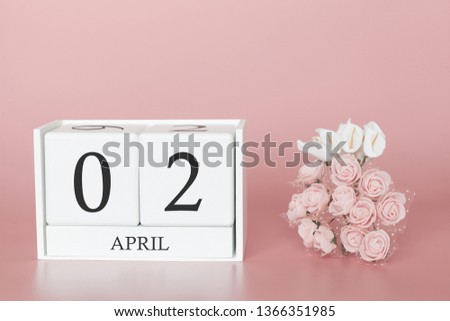 April 02nd. Day 2 of month. Calendar cube on modern pink background, concept of bussines and an importent event.