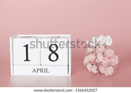 April 18th. Day 18 of month. Calendar cube on modern pink background, concept of bussines and an importent event.