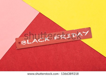  black friday cardboard paper gift tag isolated on colorful background