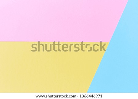 Top view flatlay pink, yellow and blue colors paper background. Horizontal photography.