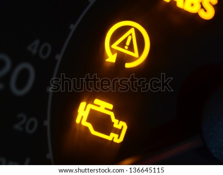 Malfunction or check engine car symbols dashboard closeup Royalty-Free Stock Photo #136645115