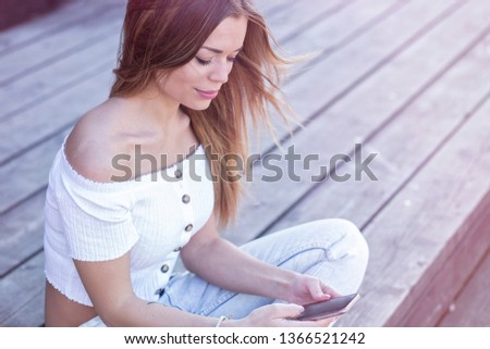Beauty Young Adult Stylish Influencer Girl Using Smartphone on Public at Summer Time