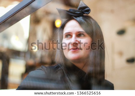 Portrait of a girl chef. Woman in black uniforms. Meet the restaurant chef.