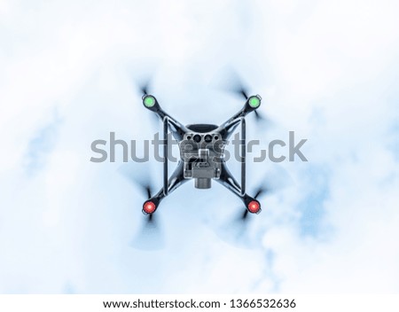 Drone in the sky. Unmanned aerial vehicle flying in the air.