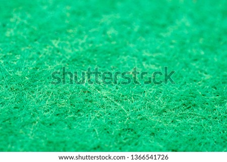 Green pile. Texture with low depth of field. Football artificial field.