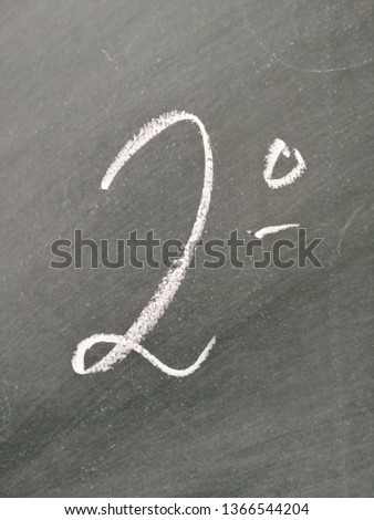 Symbol of second written with chalk on a blackboard. 