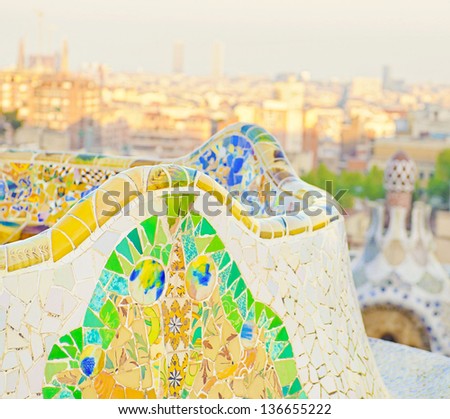 Details of a colorful ceramic bench at Parc Guell designed by Antoni Gaudi, Barcelona, Spain.
