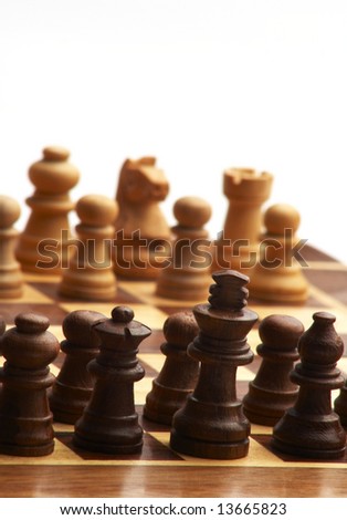Photo wooden Chess Pieces on Chess Board