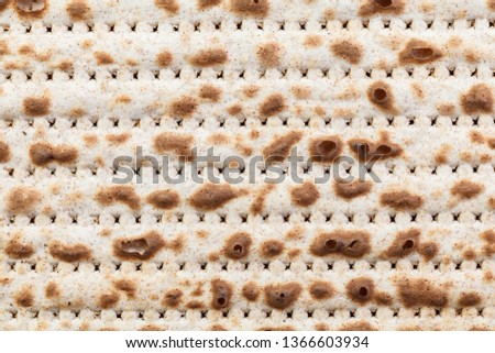 Matzah. Jewish traditional Passover bread. Pesach celebration symbol. Isolated on white. With some free space for your text or sign. Close-up.