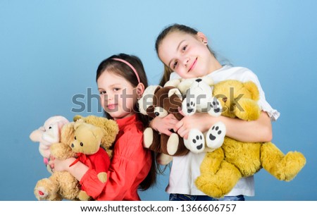 happy childhood. handmade. sewing and diy crafts. playground in kindergarten. toy shop. childrens day. small girls with soft bear toys. little sisters girls playing game in playroom. Playing together.