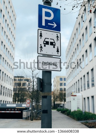 Carsharing vehicle parking sign in Munich, Germany, Europe. Modern rental ideology transport concept. Mobile photo
