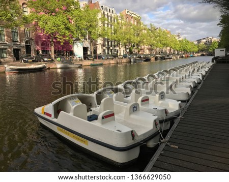 Pedalo canal bikes on the Keizersgracht canal in Amsterdam Royalty-Free Stock Photo #1366629050