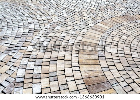 Grey paving stones as background texture closeup