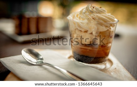 yellow and brown mousse cake on top of wooden table 