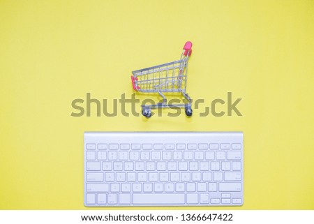 keyboard and shopping trolley, minimalist concept