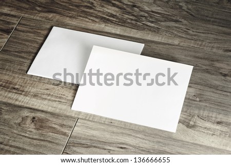 Blank corporate identity template. Package of two envelopes on wood floor.  Royalty-Free Stock Photo #136666655