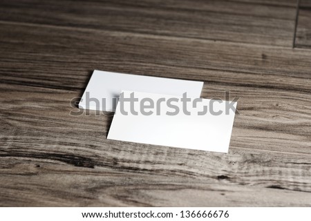 Blank corporate identity template. Package of business card envelope & letter on wood floor. 