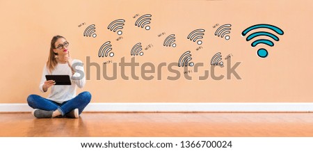 WiFi theme with young woman holding a tablet computer
