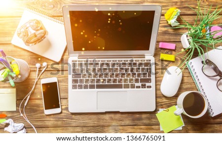 Laptop with Smartphone and coffee on  background