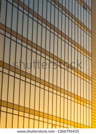 Reflections of modern commercial buildings on glasses with sunlight