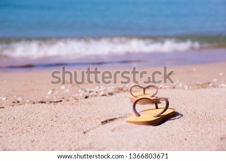 Close up slippers Beach background.