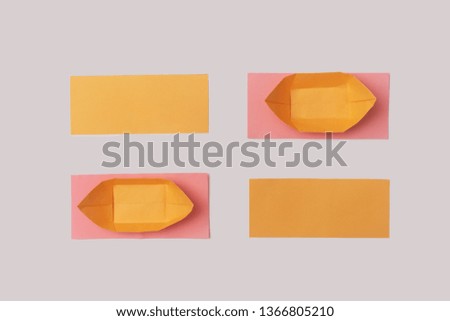 Creative pattern made of orange paper boats with colorful shapes on white background. abstract summer concept.
