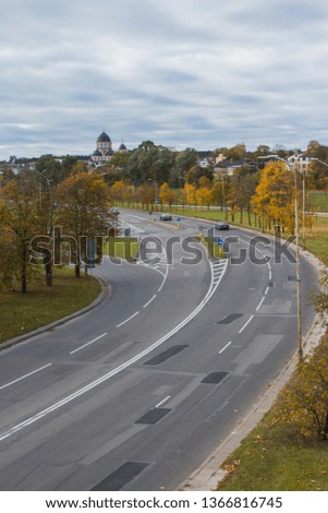 Wide highway and Our Lady of the Sign Church in the background in Vilnius. Lithuania