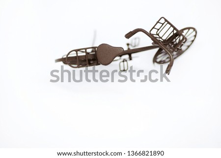 Miniature bicycle on white background.