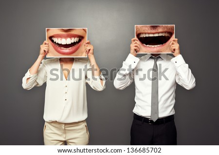 concept photo of laughing merrily couple over dark background