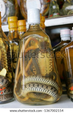 Forbidden souvenir from Laos Snake Whiskey, Snakes in whiskey bottles, Laos, Asia