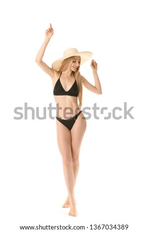 Beautiful young woman in swimming suit on white background