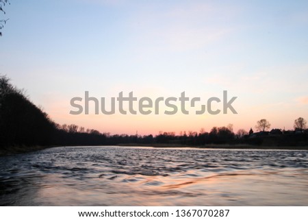 Beautiful countryside sunset view with beautiful river waves flowing through the city.