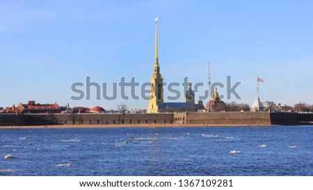 Peter and Paul Fortress on Hare's island in St. Petersburg, Russia. Panoramic outdoor view on spring day with ice floating on Neva river