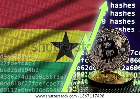 Ghana flag and rising green arrow on bitcoin mining screen and two physical golden bitcoins