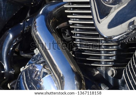 Fragment of chromed shiny body part of old classic motorbike