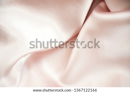 Tender pink pastel textile background with copy space. Pink fabric textures background, fabric uneven. Abstract blur of pink fabric for Wedding background. Pink silk fabric defocused for background.