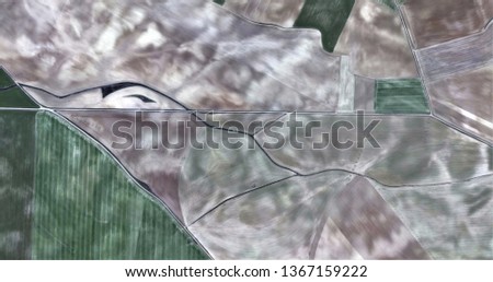 the dolphin's depression, composition in white and green, tribute to Picasso, abstract photography of the Spain fields from the air, aerial view, representation of human labor camps, abstract art, 