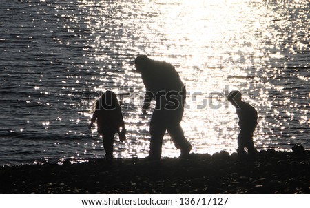 People silhouette on the beach