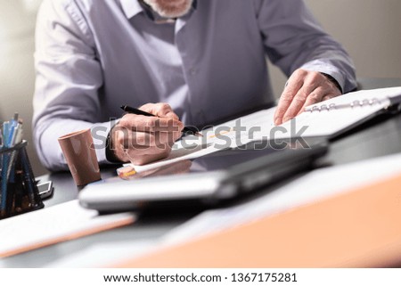 Businessman working on documents in office