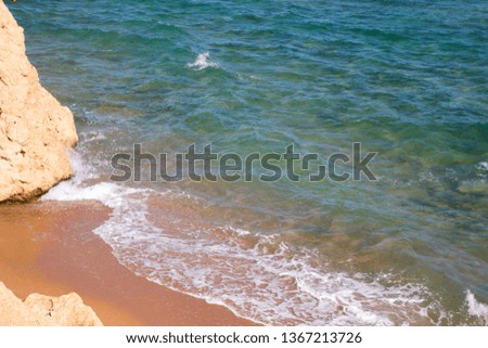 Beautiful coastline with sand and water. blue sea wave photograph close up. vacation at sea or ocean. Background to insert images and text.