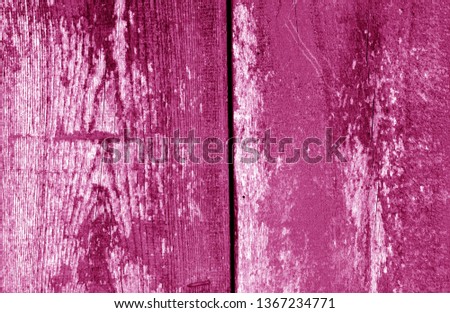 Old grungy wooden planks background in pink tone. Abstract background and texture for design.